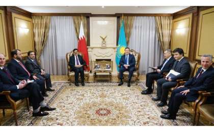 马明会见卡塔尔副首相库瓦里