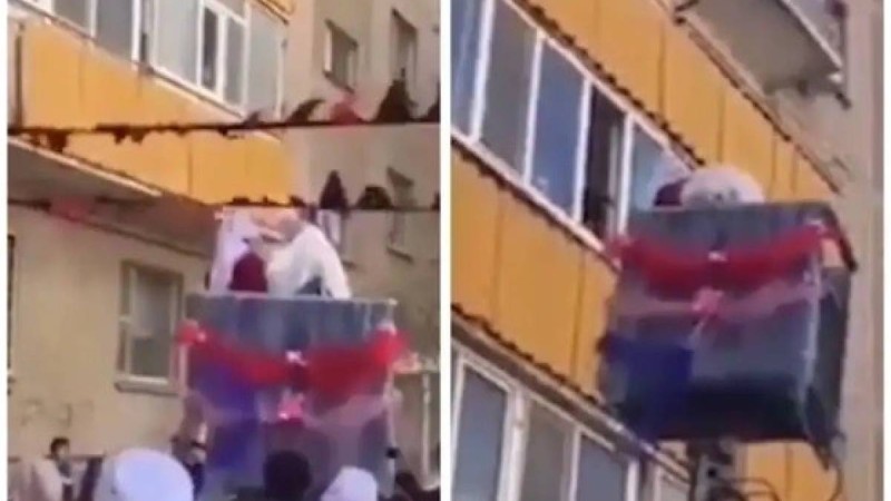 Жас келінді жоғары қабаттағы үйге кранмен кіргізгендер елді шулатты (ВИДЕО)