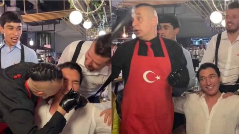 Әлішер Кәрімовті бір топ жігіт сүйіп, денесін уқалаған видеосы тарады