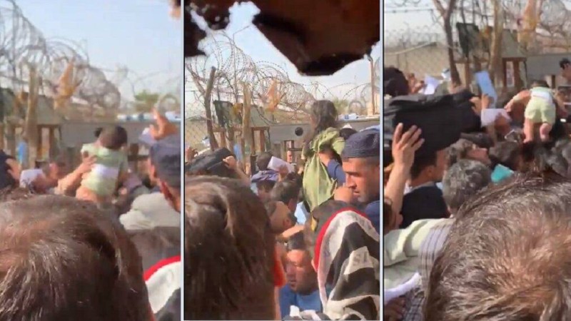 Ауғандық ана сәбиін құтқару үшін тікенек сым арқылы сыртқа қарай лақтырып жіберді (видео)